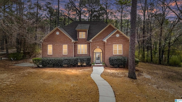 view of front of home with brick siding