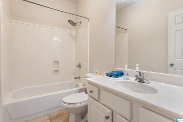 bathroom featuring toilet, tile patterned flooring, washtub / shower combination, and vanity