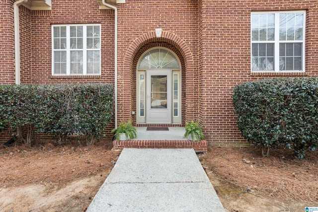 entrance to property with brick siding