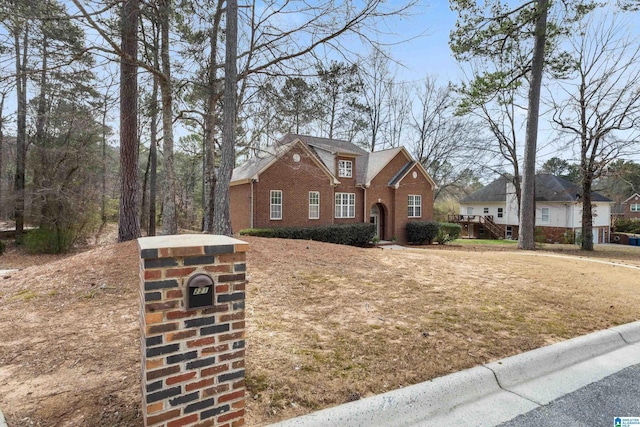 traditional home featuring brick siding