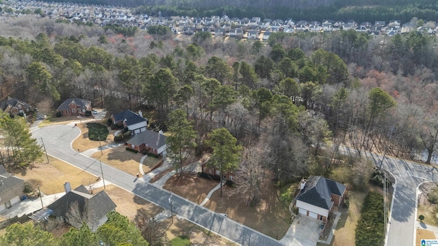 bird's eye view featuring a residential view and a view of trees