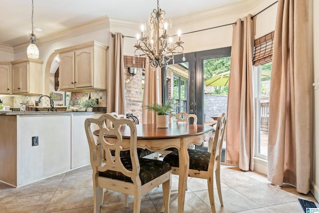 dining space featuring a notable chandelier, light tile patterned flooring, visible vents, and crown molding