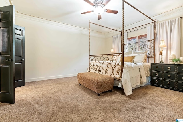 bedroom featuring carpet floors, baseboards, and crown molding