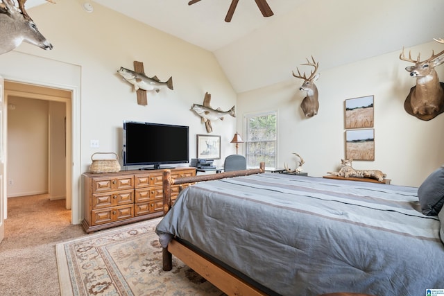 bedroom with carpet floors, lofted ceiling, and ceiling fan