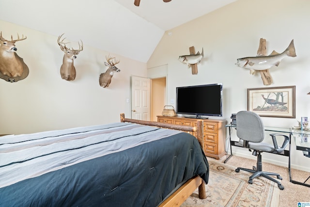 bedroom with light carpet, vaulted ceiling, a ceiling fan, and baseboards