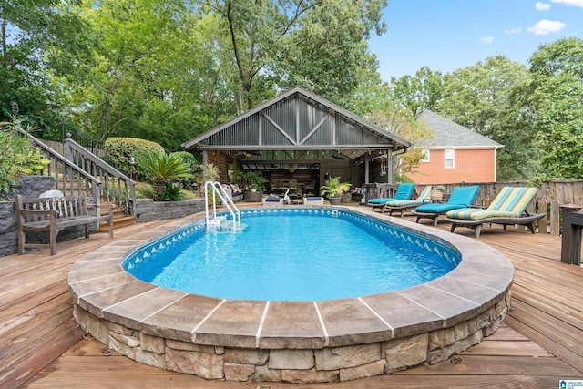 view of swimming pool featuring a deck and stairs