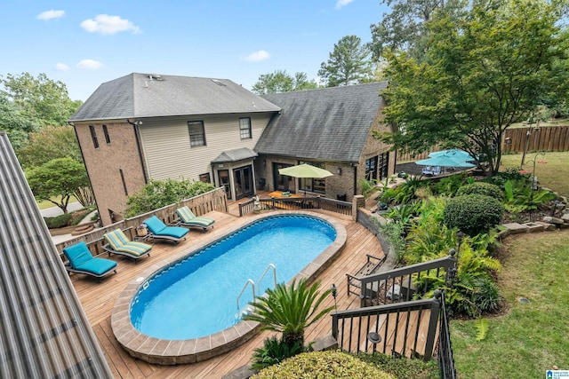 view of pool with a deck and a fenced in pool