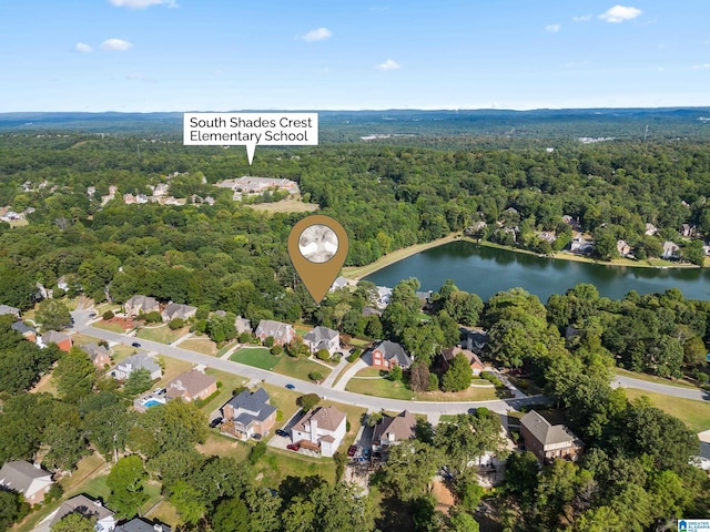 aerial view with a water view, a forest view, and a residential view