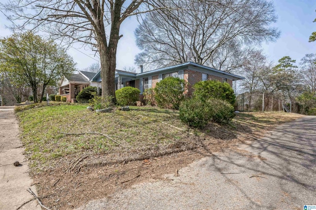 view of front of house with brick siding