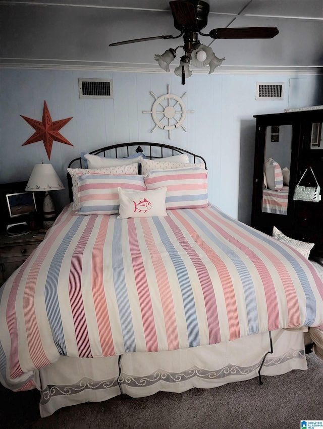 bedroom featuring visible vents, a ceiling fan, and ornamental molding