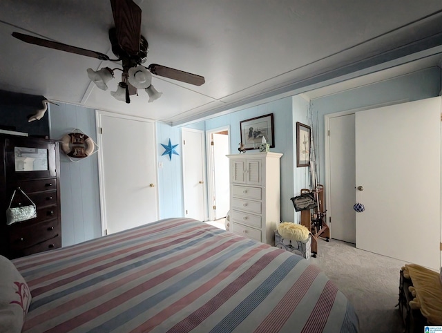 carpeted bedroom with a ceiling fan