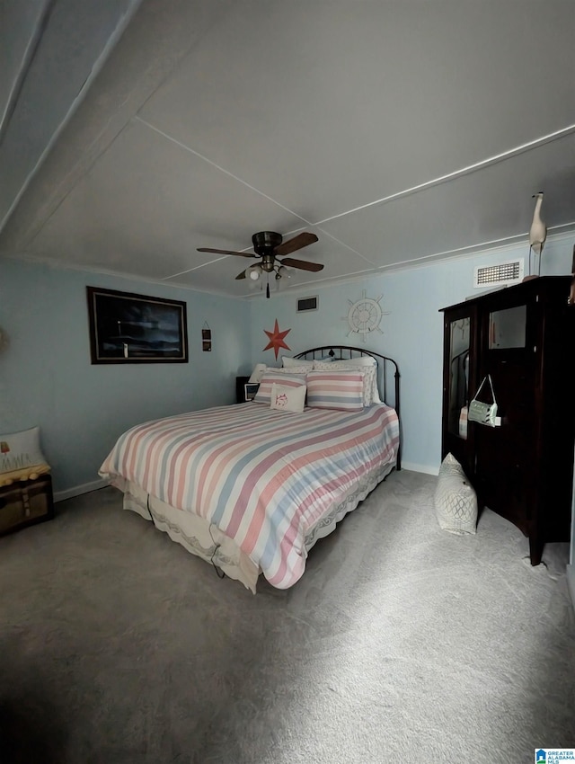 carpeted bedroom with ceiling fan, visible vents, and baseboards