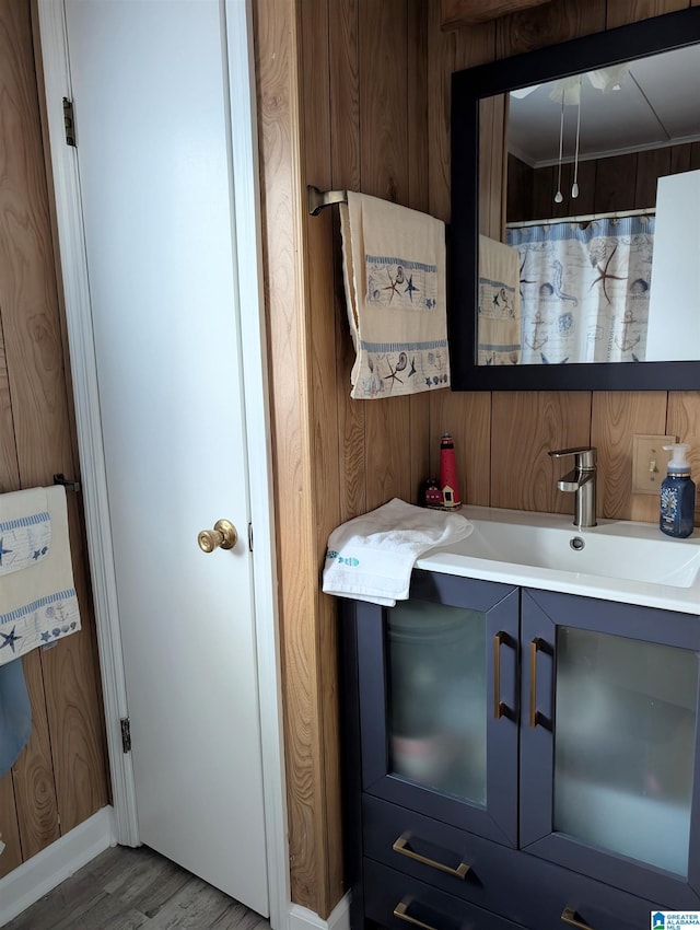 interior space featuring light countertops, a sink, and wood finished floors