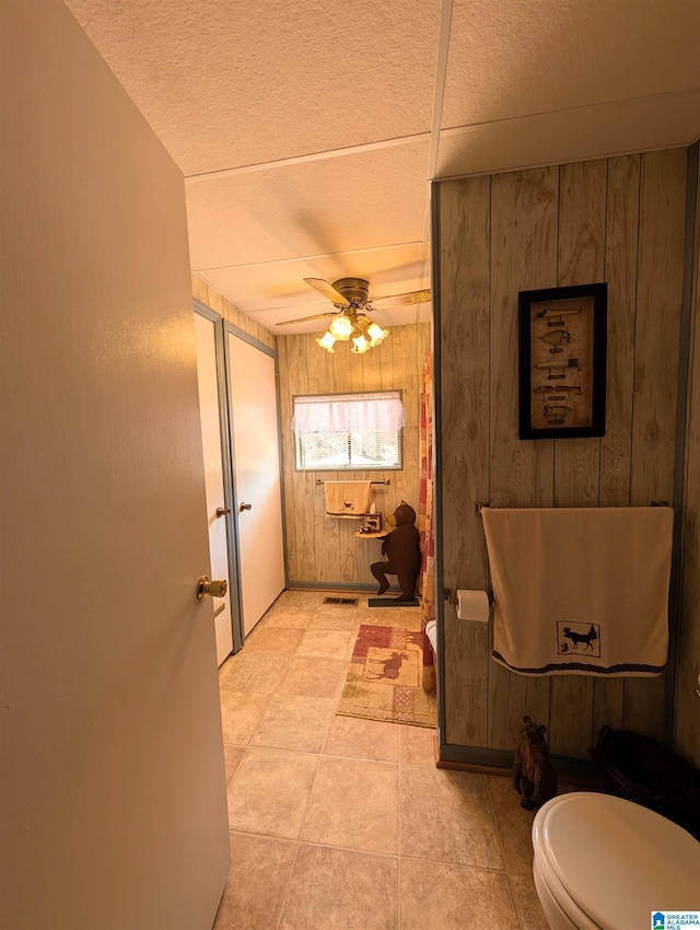 bathroom featuring toilet, visible vents, and a ceiling fan