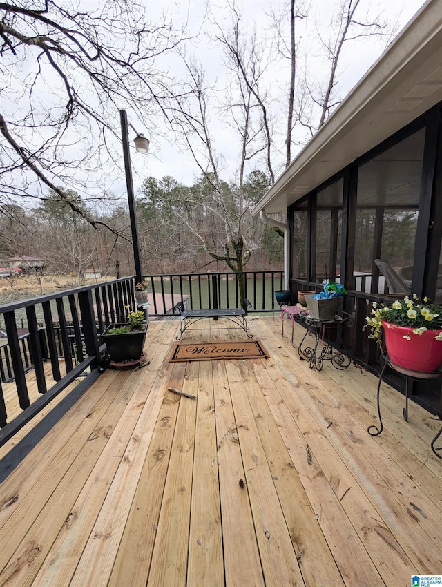 wooden terrace with a sunroom