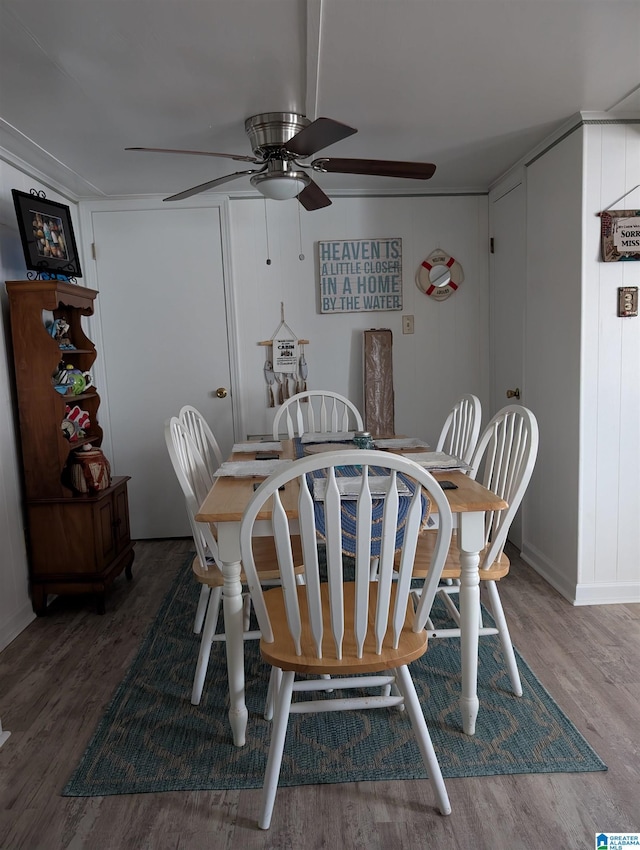 dining room featuring wood finished floors and a ceiling fan