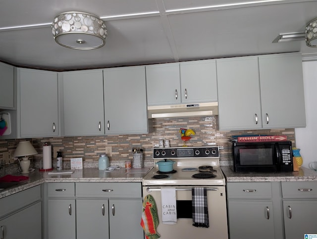 kitchen featuring under cabinet range hood, white range with electric stovetop, black microwave, and backsplash