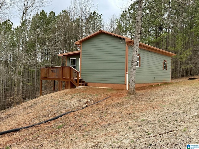 view of side of home featuring a deck