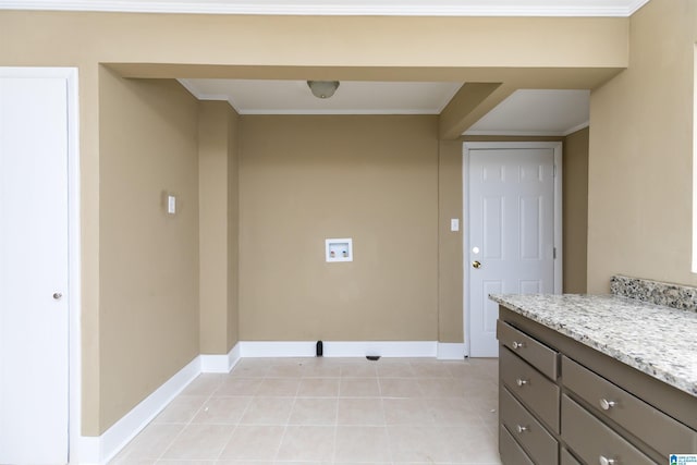 washroom featuring light tile patterned flooring, crown molding, and baseboards