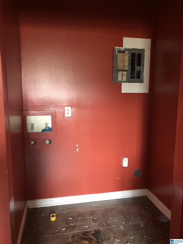 washroom featuring hookup for a washing machine, electric panel, and baseboards