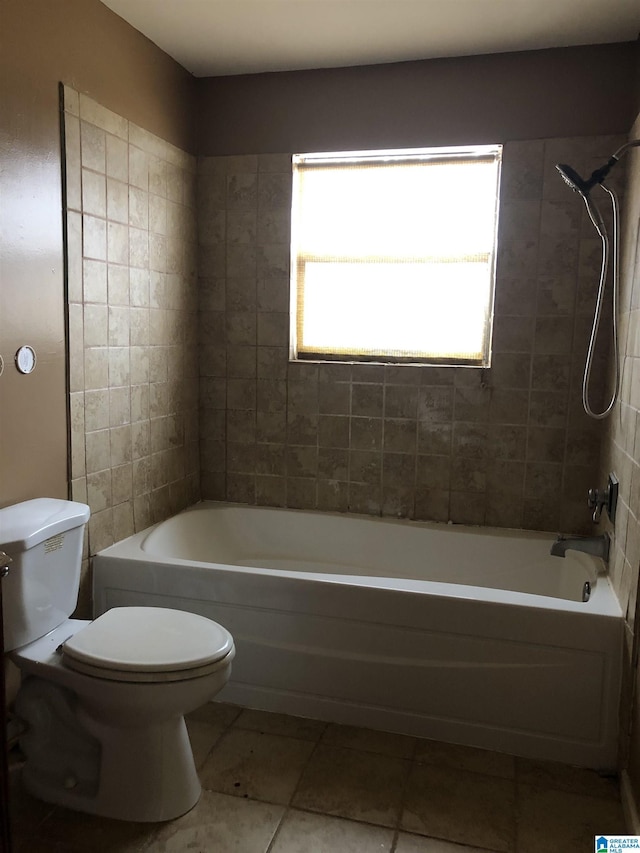 bathroom featuring toilet and shower / bathtub combination