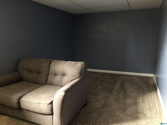 sitting room with a paneled ceiling, baseboards, and carpet flooring