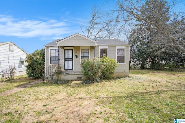 bungalow featuring crawl space and a front lawn