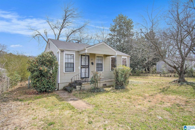 bungalow featuring crawl space and a front lawn