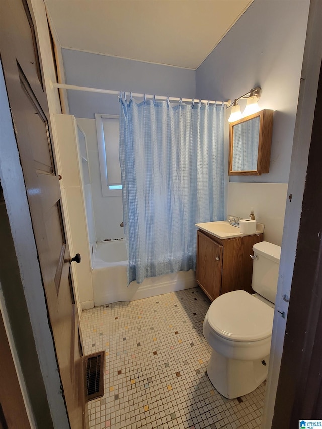 bathroom featuring shower / tub combo, visible vents, toilet, tile patterned floors, and vanity