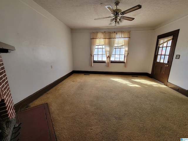 interior space featuring light carpet, a brick fireplace, baseboards, and a textured ceiling