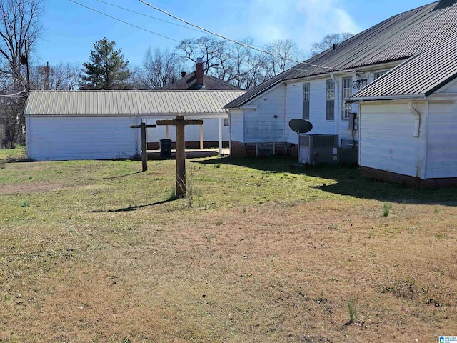 view of yard featuring central AC and a pergola