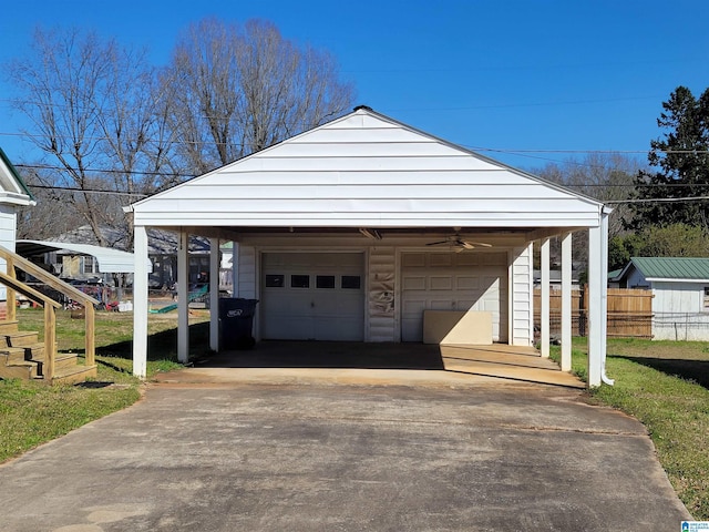 garage with a garage and fence