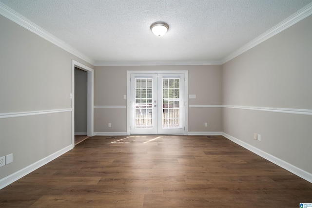 spare room with dark wood-style floors, french doors, a textured ceiling, and baseboards