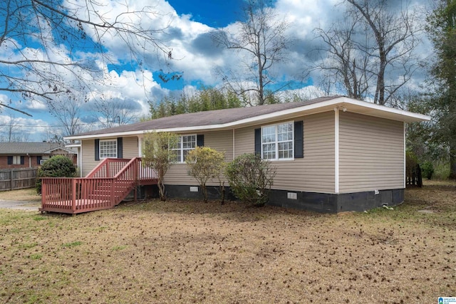 view of front of property featuring crawl space, fence, and a deck