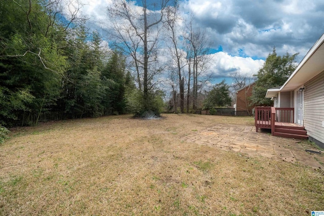 view of yard featuring a wooden deck