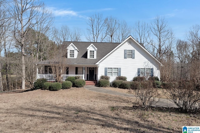 cape cod-style house with covered porch