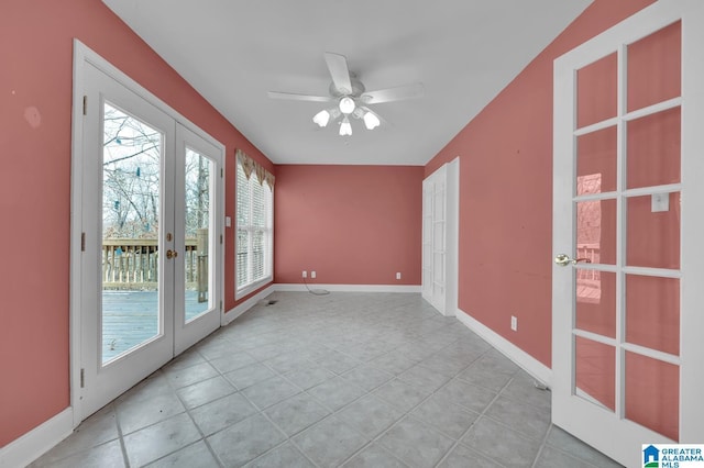 unfurnished room featuring ceiling fan, french doors, light tile patterned floors, and baseboards