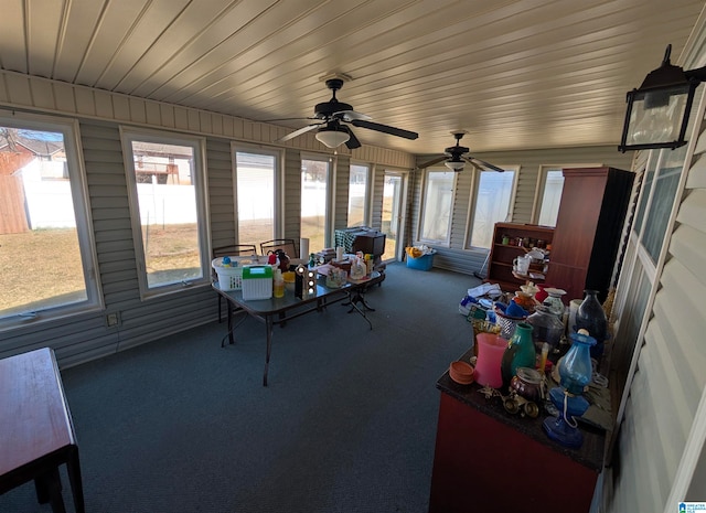 sunroom / solarium with a ceiling fan