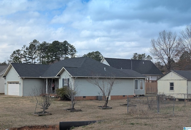 view of front facade featuring crawl space, a shingled roof, a garage, and fence