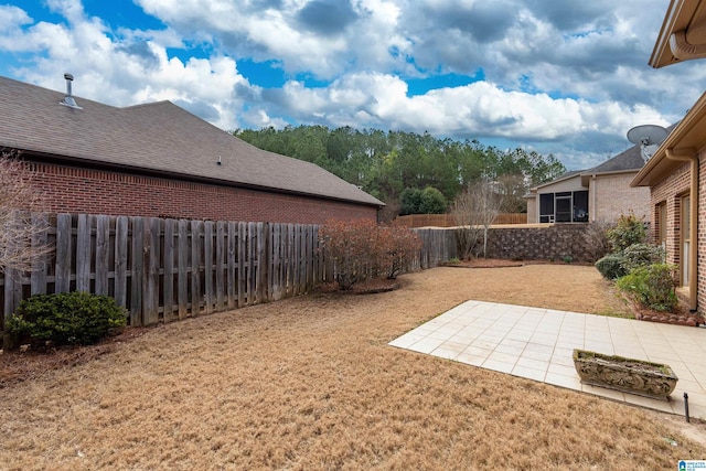 view of yard featuring a fenced backyard and a patio