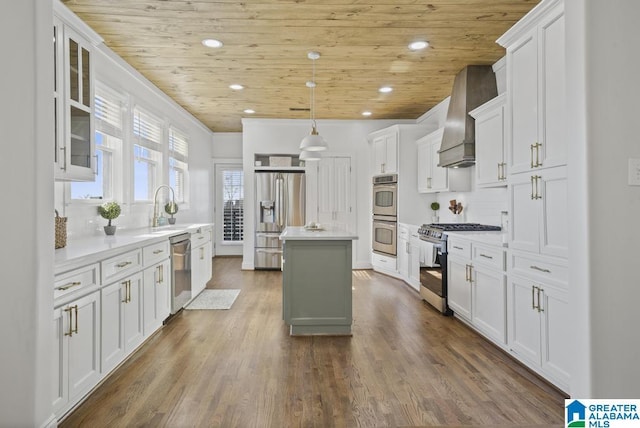 kitchen featuring wood ceiling, custom range hood, stainless steel appliances, and a center island