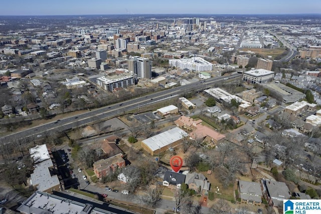 birds eye view of property with a city view