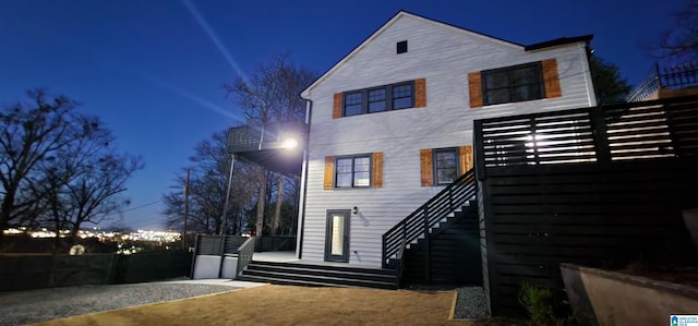 back of house at night with stairway