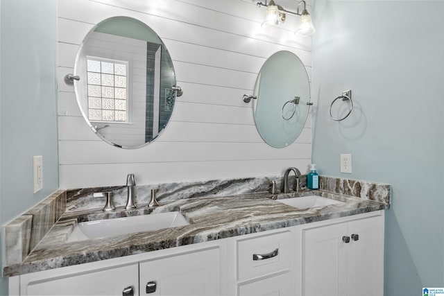 full bath featuring double vanity and a sink