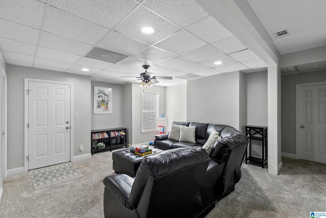 living room with a ceiling fan, carpet, visible vents, and baseboards