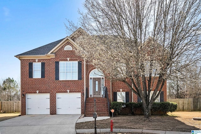 view of front facade featuring an attached garage, brick siding, fence, driveway, and roof with shingles