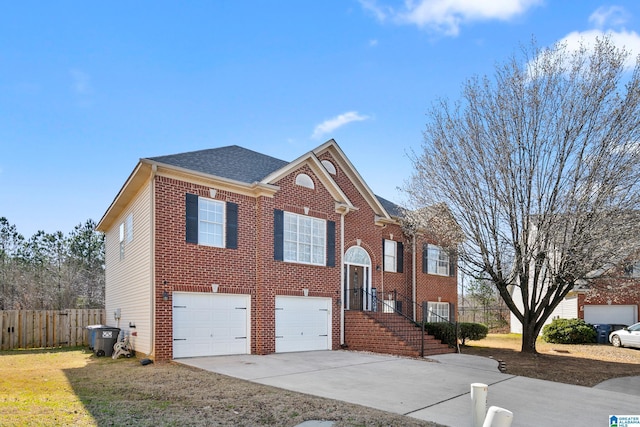 view of front of property featuring driveway, an attached garage, fence, and brick siding