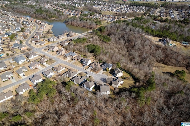 birds eye view of property with a water view and a residential view