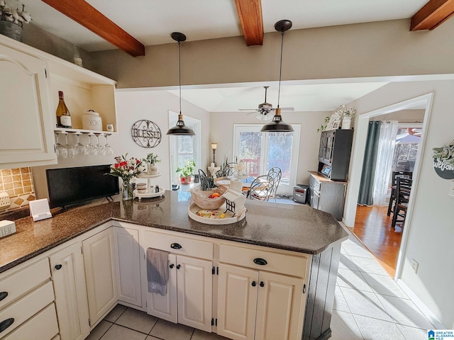 kitchen with a peninsula, tasteful backsplash, open shelves, and beamed ceiling