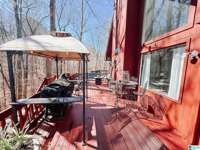 wooden deck with outdoor dining space